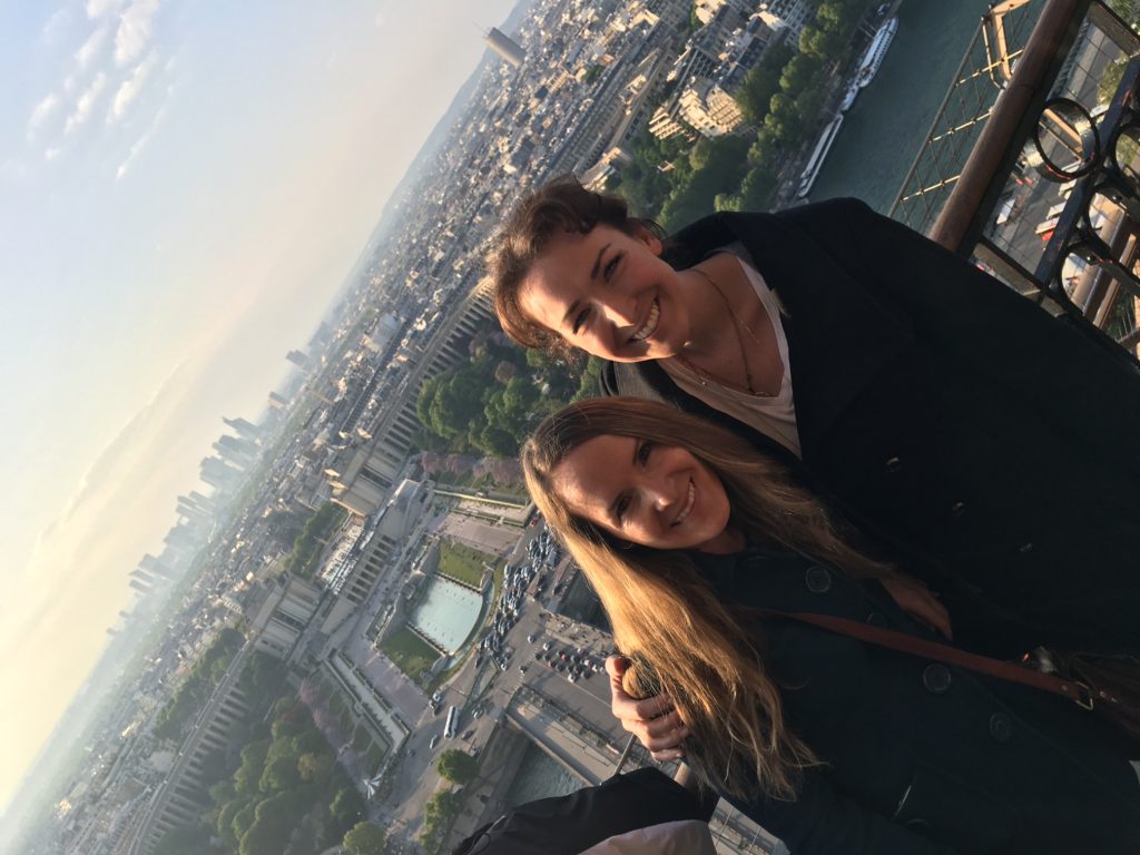 Paris stretches out behind the Rose Sisters from the Eiffel Tour